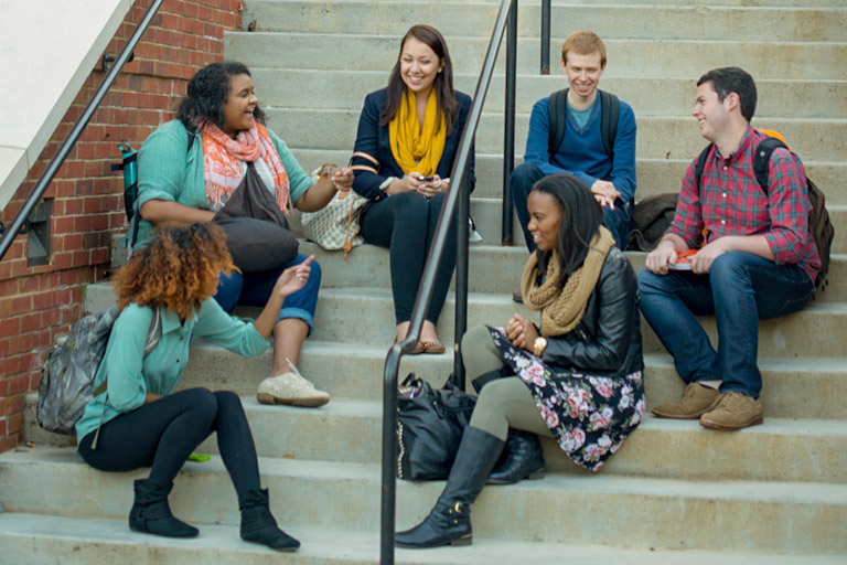 Engineering Students Talk as a Group Outside Tickle Building
